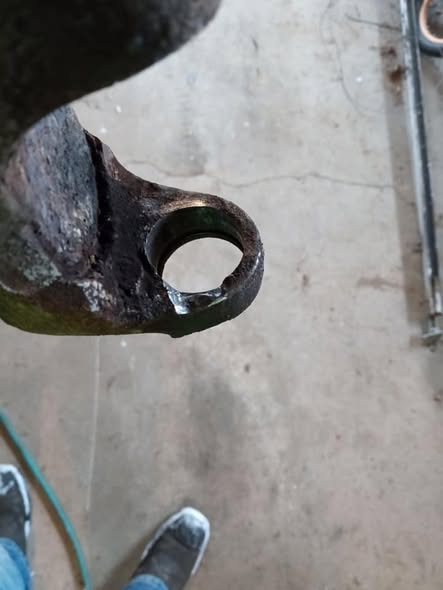 Repaired slip yoke with a section rebuilt by welding